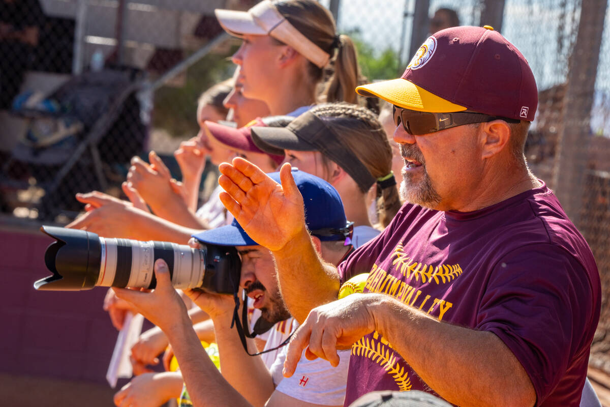 The Trojans bench celebrates the offensive production against The Meadows at home on April 29. ...