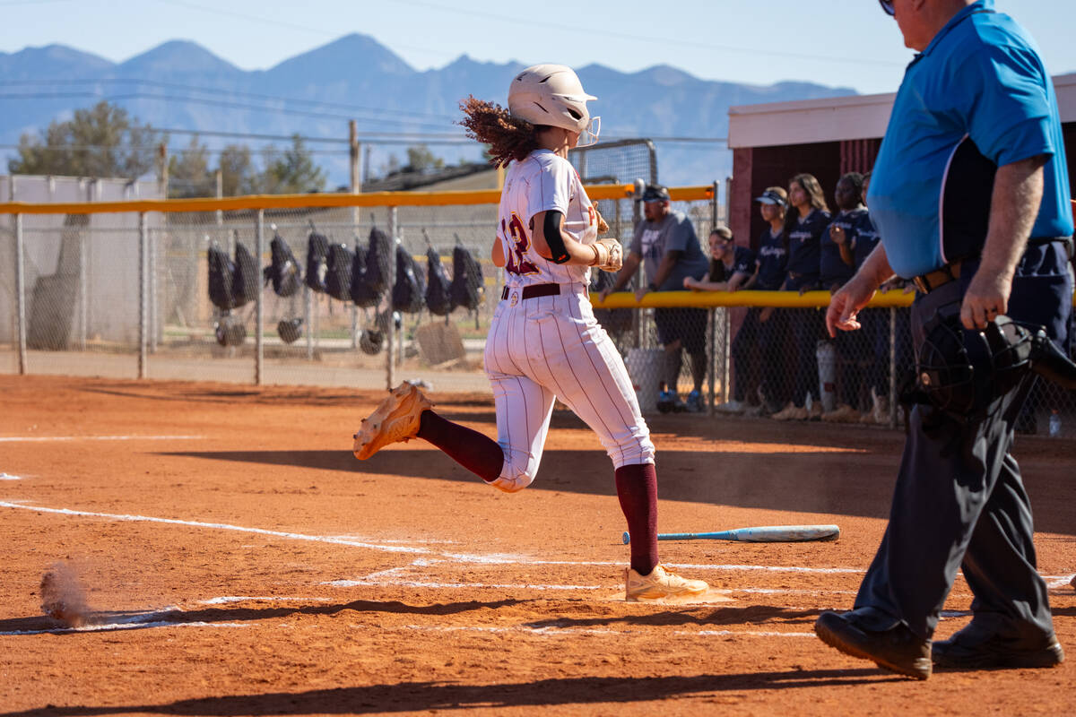 Pahrump Valley High School sophomore Mariah Gray comes across the plate to score a run for the ...