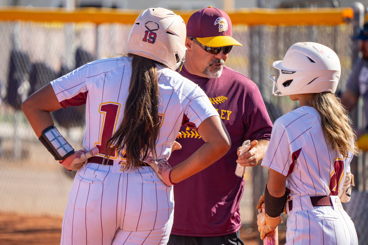 Pahrump Valley assistant coach Rich Lauver talks to Trojan freshman Jaelyn Rodriguez and Aspen ...
