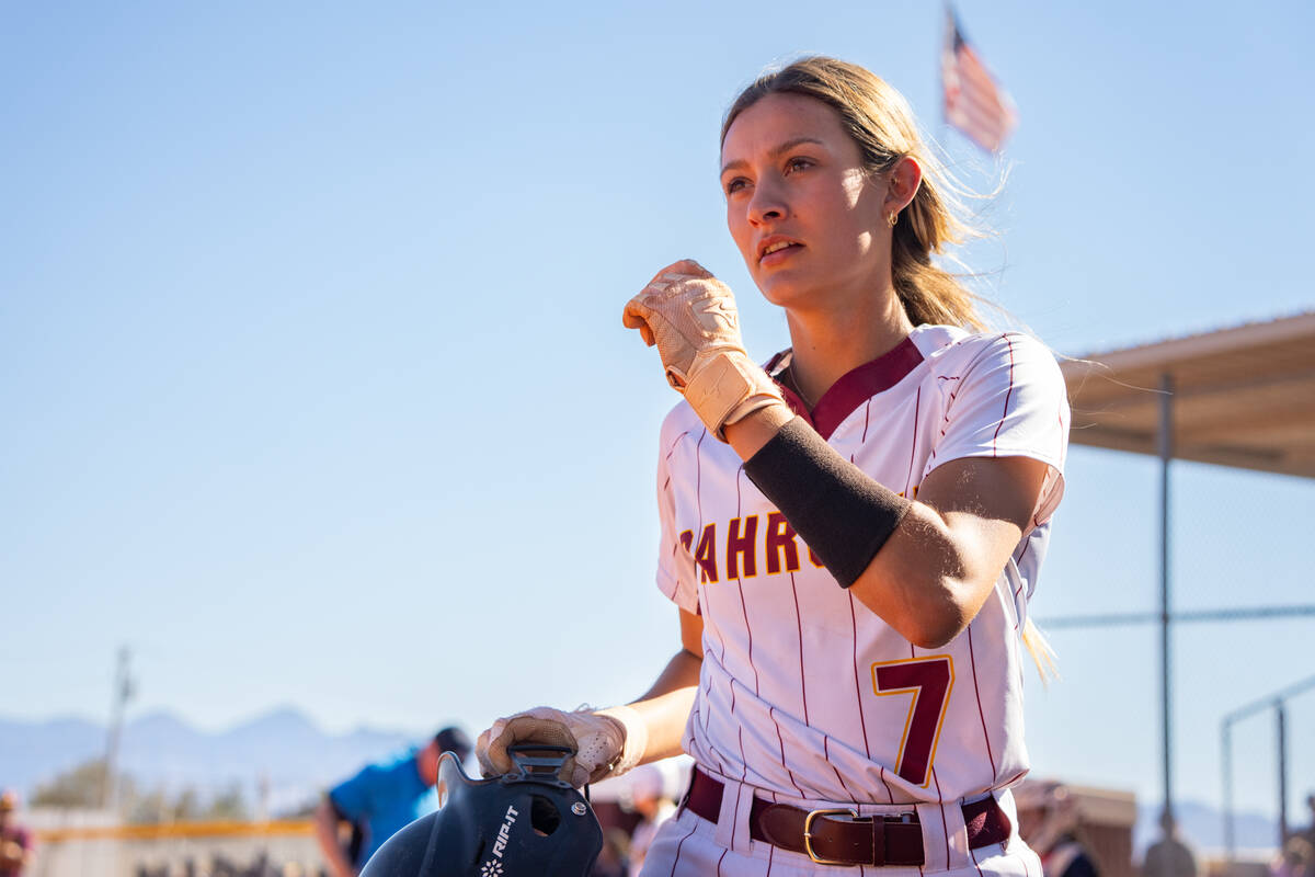 Pahrump Valley High School junior Riley Saldana catches her breath after sliding into home safe ...