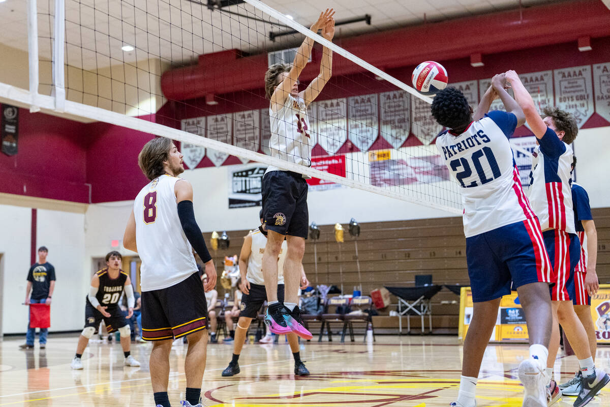Pahrump Valley High School James Wilson gets into position to set a block against American Heri ...