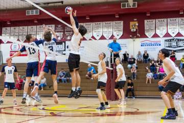 Pahrump Valley High School senior Alexander Mahoney makes a block attempt against American Heri ...