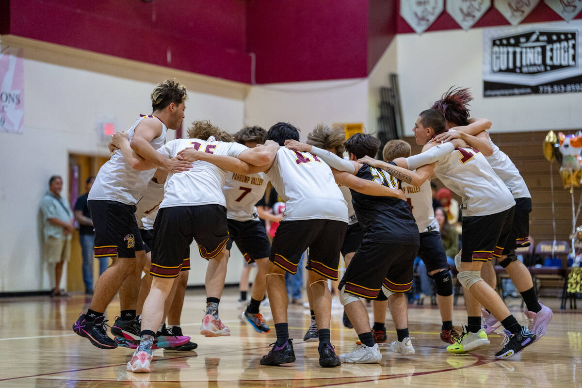 Members of the 2026 Pahrump Valley High School boys volleyball program huddle together for a ra ...