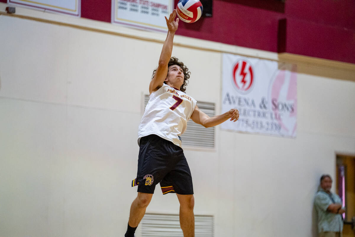 Pahrump Valley High School senior Ryan Nasso serves up a stinging serve against American Herita ...