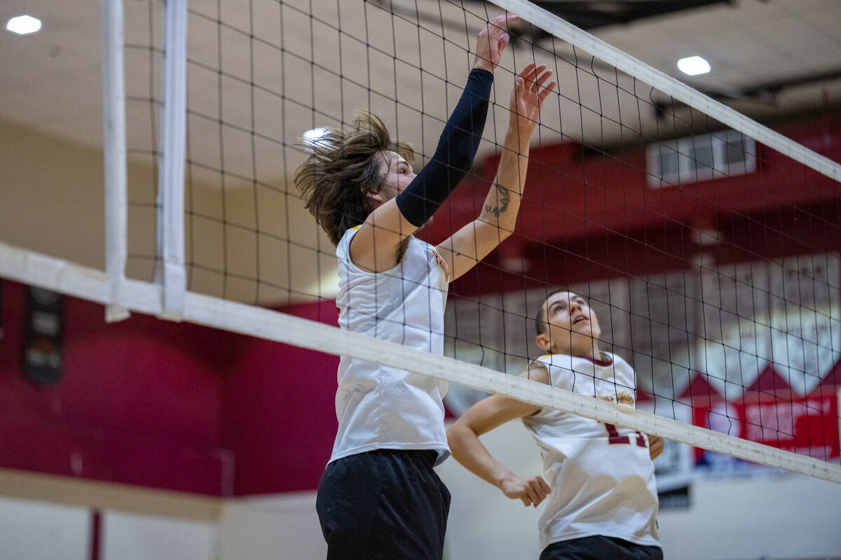 Pahrump Valley High School senior Elijah Thompson prepares himself to make a block attempt on a ...