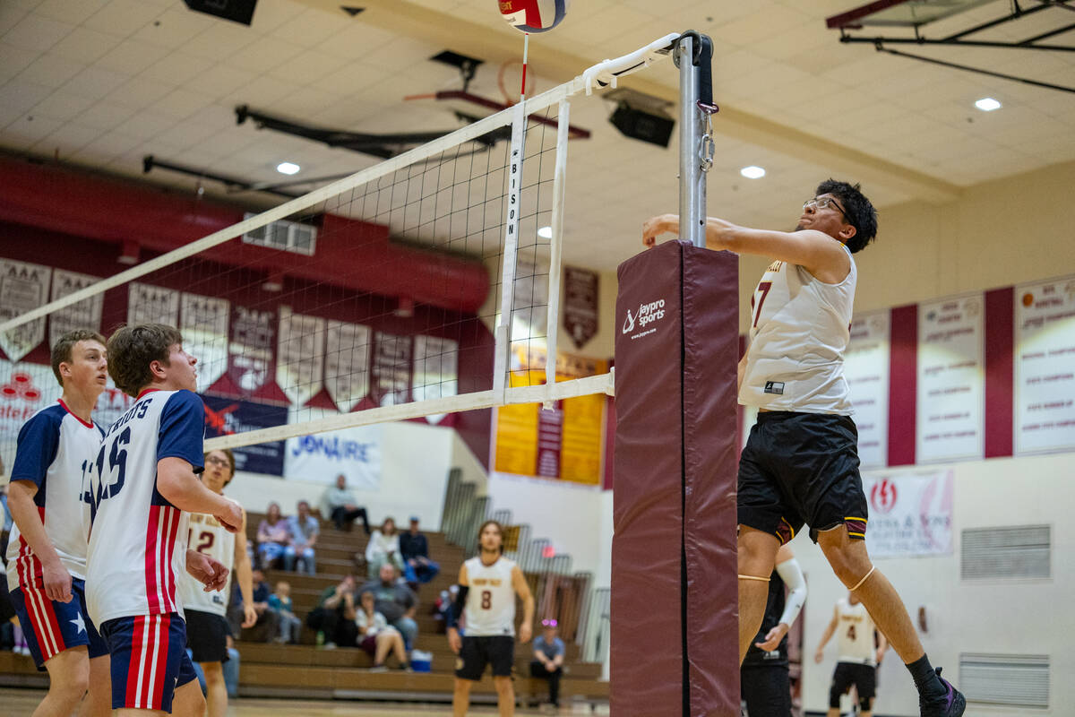Pahrump Valley High School senior Andy Sanchez leverages himself outside to attempt to make a k ...