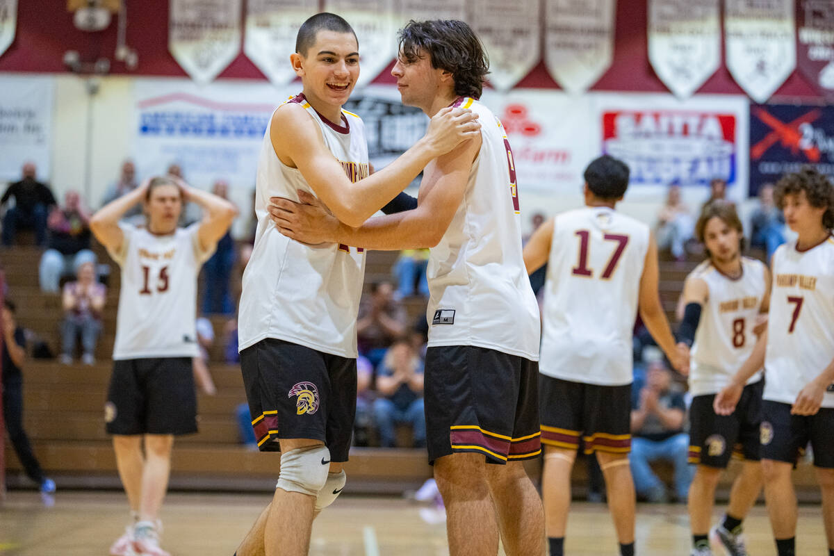 Pahrump Valley High School teammates George Anderson and Alexander Mahoney pick each other up i ...