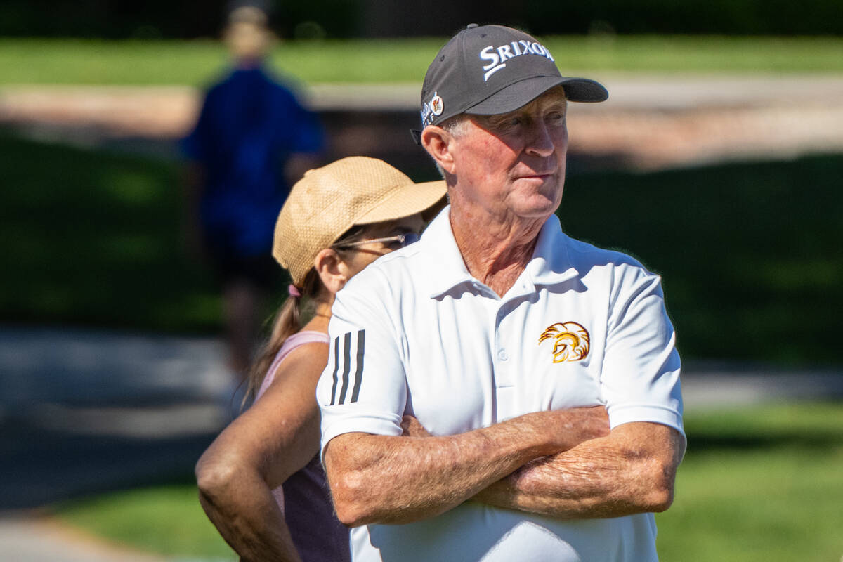Pahrump Valley High School boys golf head coach Bob Hopkins watches his players tee off during ...