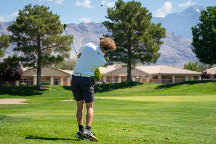Pahrump Valley High School boys golf senior Keir Sheppard tees off on his home turf at Mountain ...