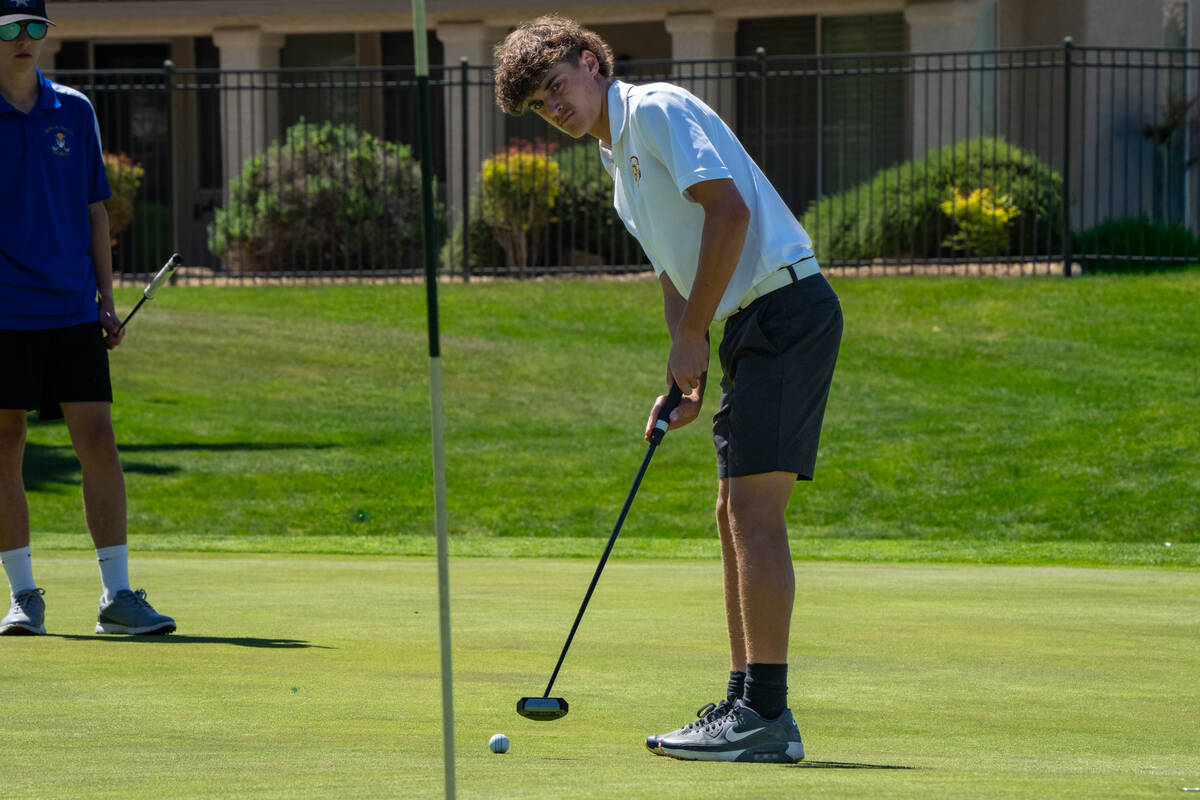 Pahrump Valley High School senior Keir Sheppard attempts to nail a putt during the Class 3A Sou ...