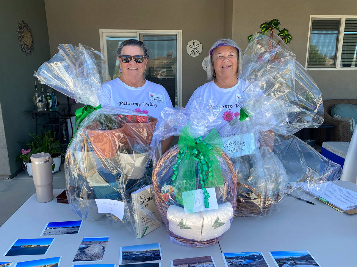 Two Pahrump Valley Garden Club members were on hand at the Landscape Tour's site six to hand ou ...