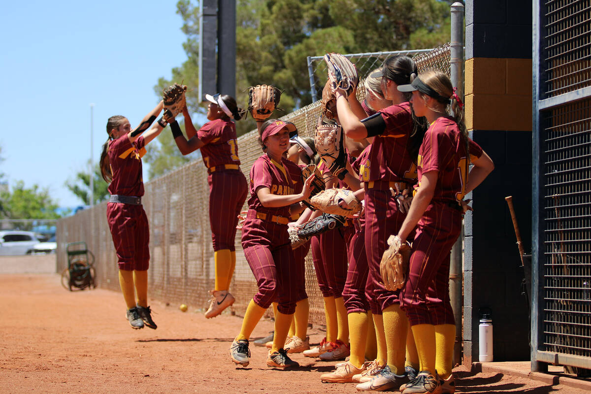 The Lady Trojans pump each other up prior to a playoff game against Moapa Valley on May 7 in Bo ...