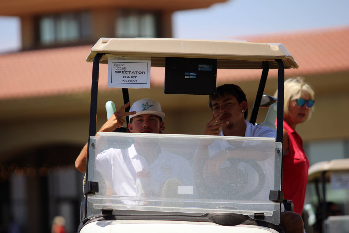 PVHS boys golf teammates Cayden Cowley and Travis Floyd share a smile in their cart before teei ...