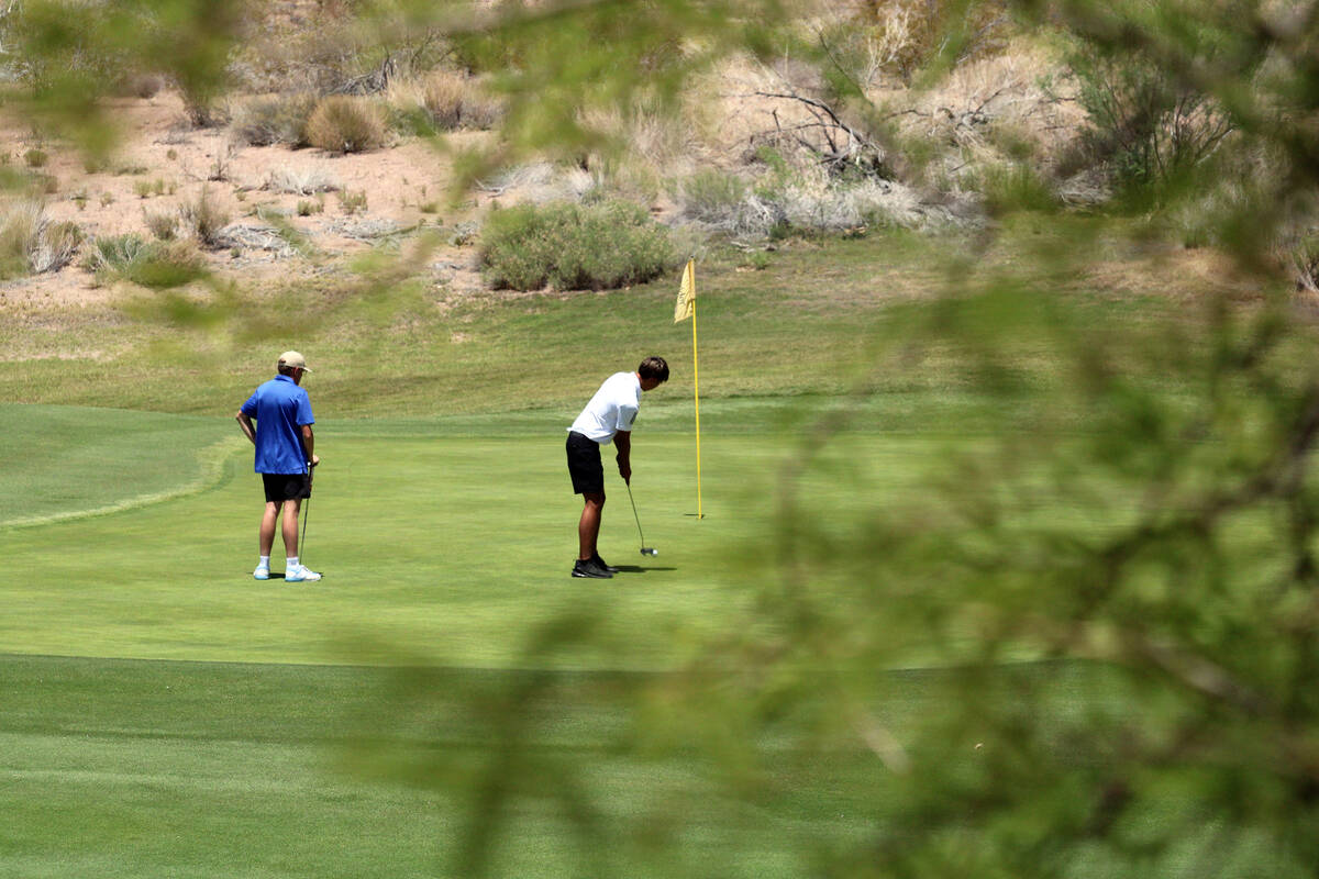 Pahrump Valley High School boys golf senior Cayden Cowley tees off on Coyote Run course at Boul ...