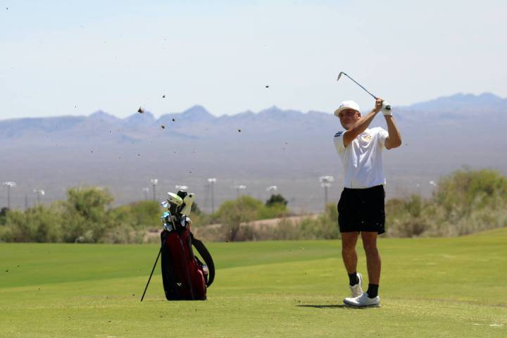 Pahrump Valley High School boys golf junior Aaron Rily tees off on Coyote Run course at Boulder ...