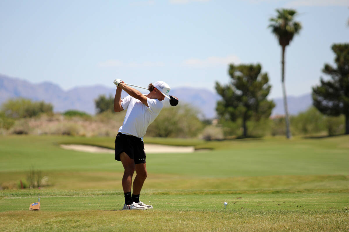 Pahrump Valley High School junior Travis Floyd tees off for a drive during the 2026 Class 3A Bo ...