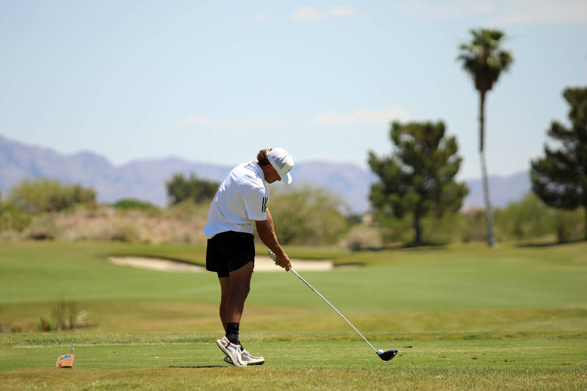 Pahrump Valley High School junior Travis Floyd tees off for a drive during the 2026 Class 3A Bo ...
