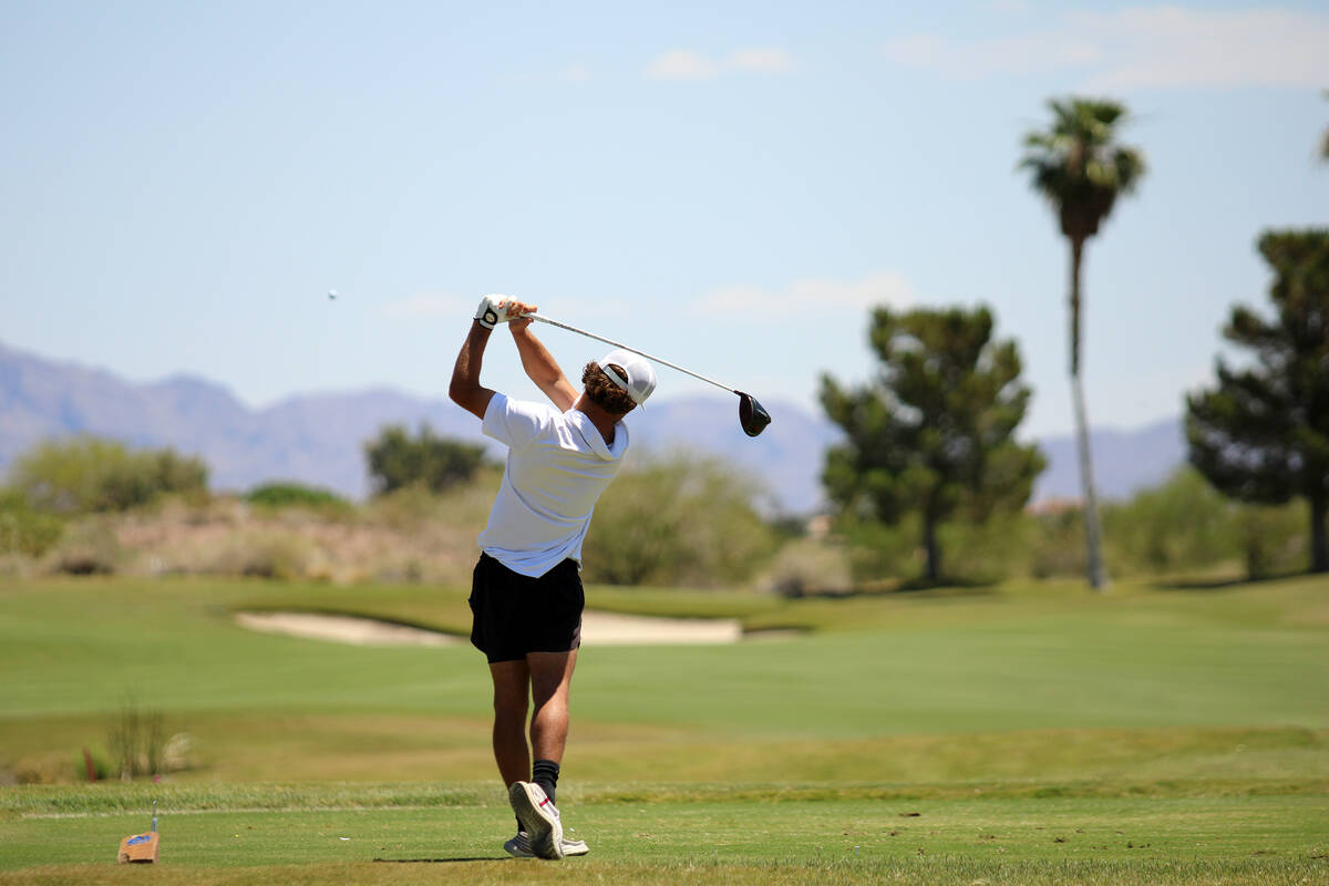 Pahrump Valley High School junior Travis Floyd tees off for a drive during the 2026 Class 3A Bo ...