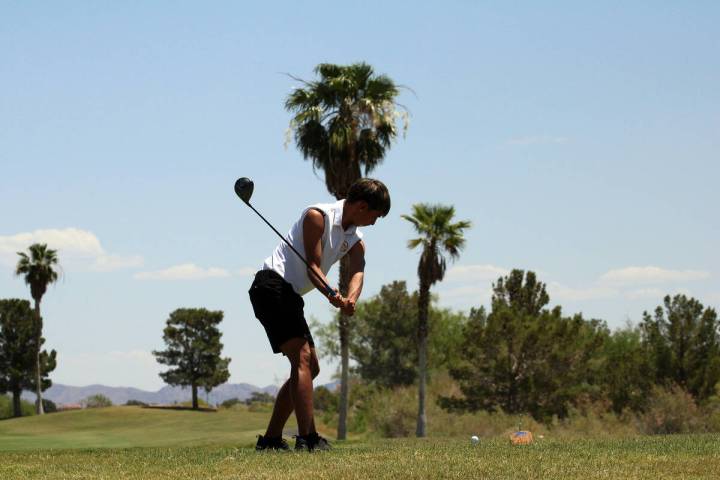 Pahrump Valley High School senior Cayden Cowley prepares to drive a ball deep during the Class ...