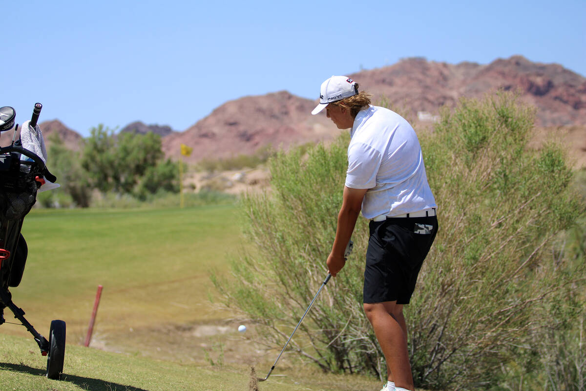 Pahrump Valley High School freshman Brody Myers does his best to get out of a tough spot during ...