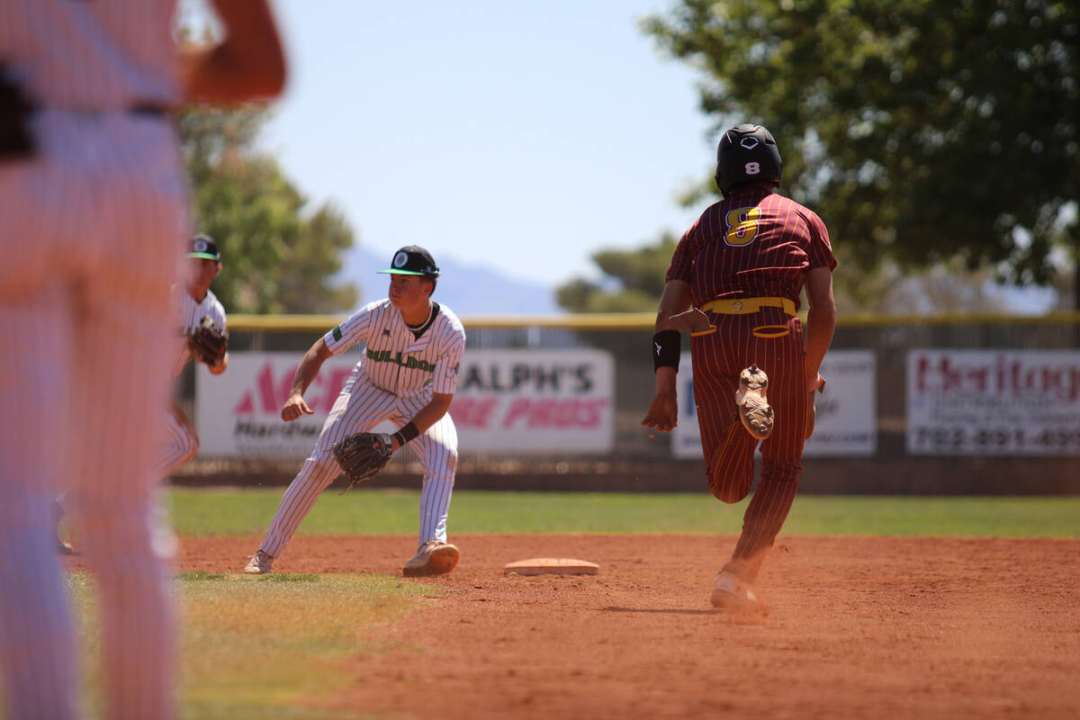 Pahrump Valley High School senior Kayne Horibe attempts to steal second base against Virgin Val ...