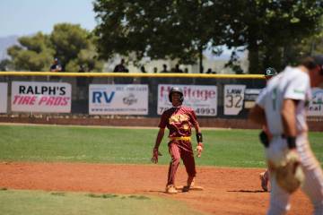 Pahrump Valley High School senior Vinny Whitney lets out a war cry celebration following his le ...