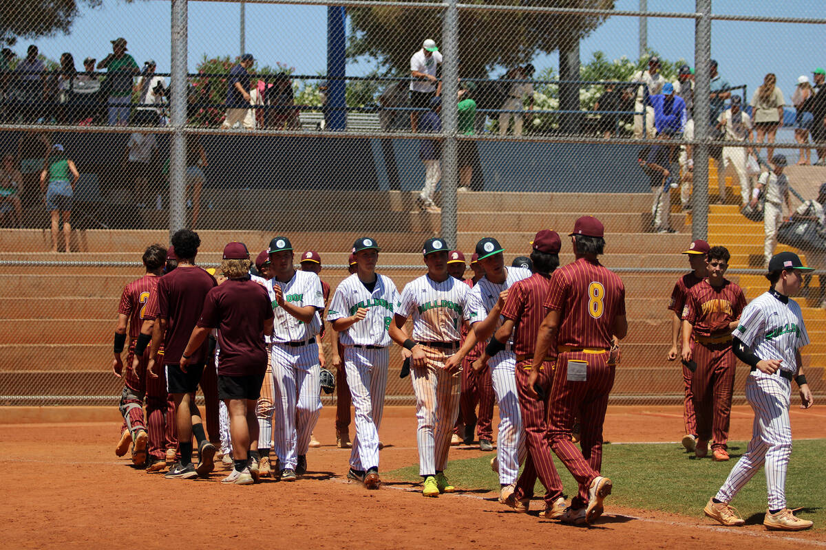 The Trojans gather at home plate to congratulate their opponents following a 12-inning, 4-3 los ...