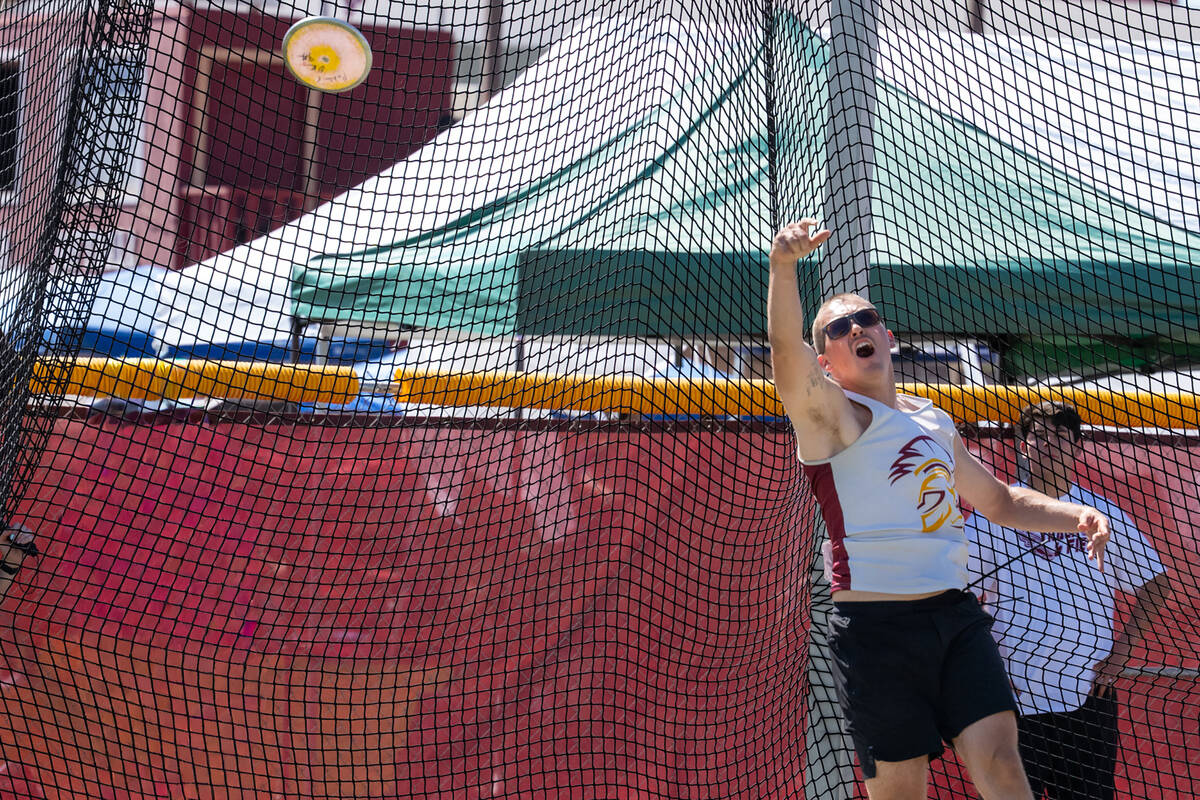 Pahrump Valley High School senior Brenden Thorne launches a discuss during the Trojans' Class 3 ...