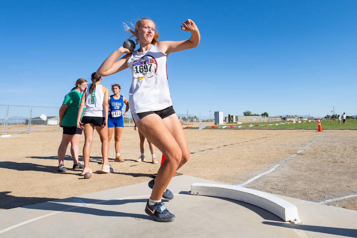 Pahrump Valley High School senior Julieanne Briggs gears to launch her shot during the Trojans' ...