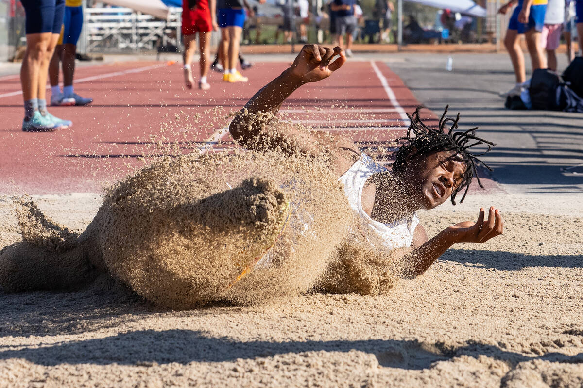 Pahrump Valley High School senior Jayden Crisler participates in the long jump during the Class ...