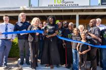 Mariatu “Tu” Browne (center), surrounded by members of the Chamber of Commerce, friends, fa ...