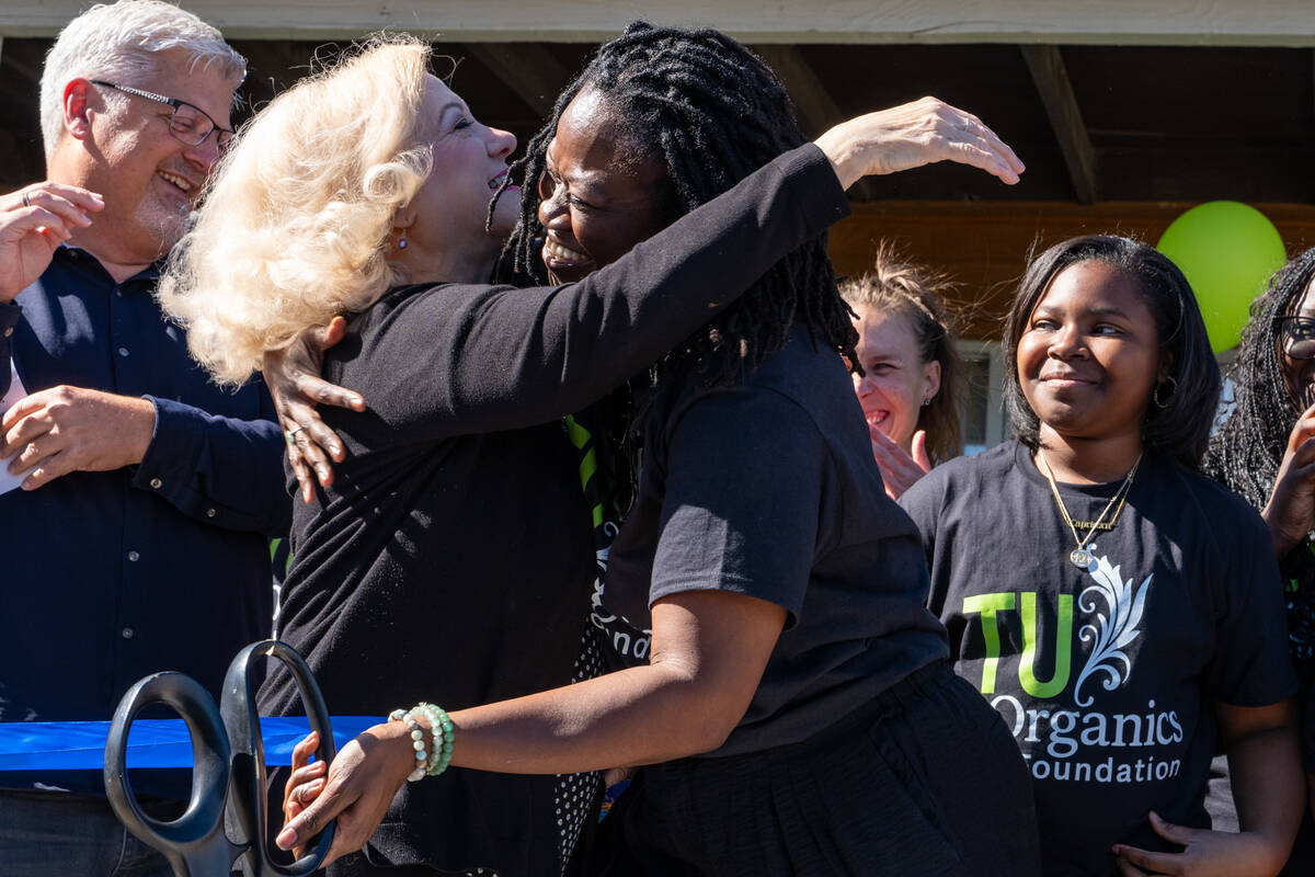 Jenney Sartin (left), CEO of the Chamber of Commerce, hugs Mariatu “Tu” Browne of Tu Organi ...