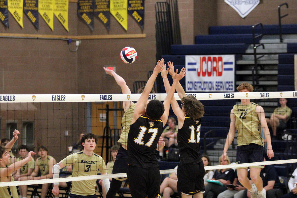 Pahrump Valley High School boys volleyball players Andy Sanchez and George Anderson set up for ...