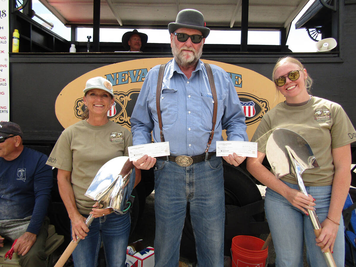 Stretch Baker presents checks to Lisa Maslach and Hannah Dowers, who won 1st place in the Nevad ...