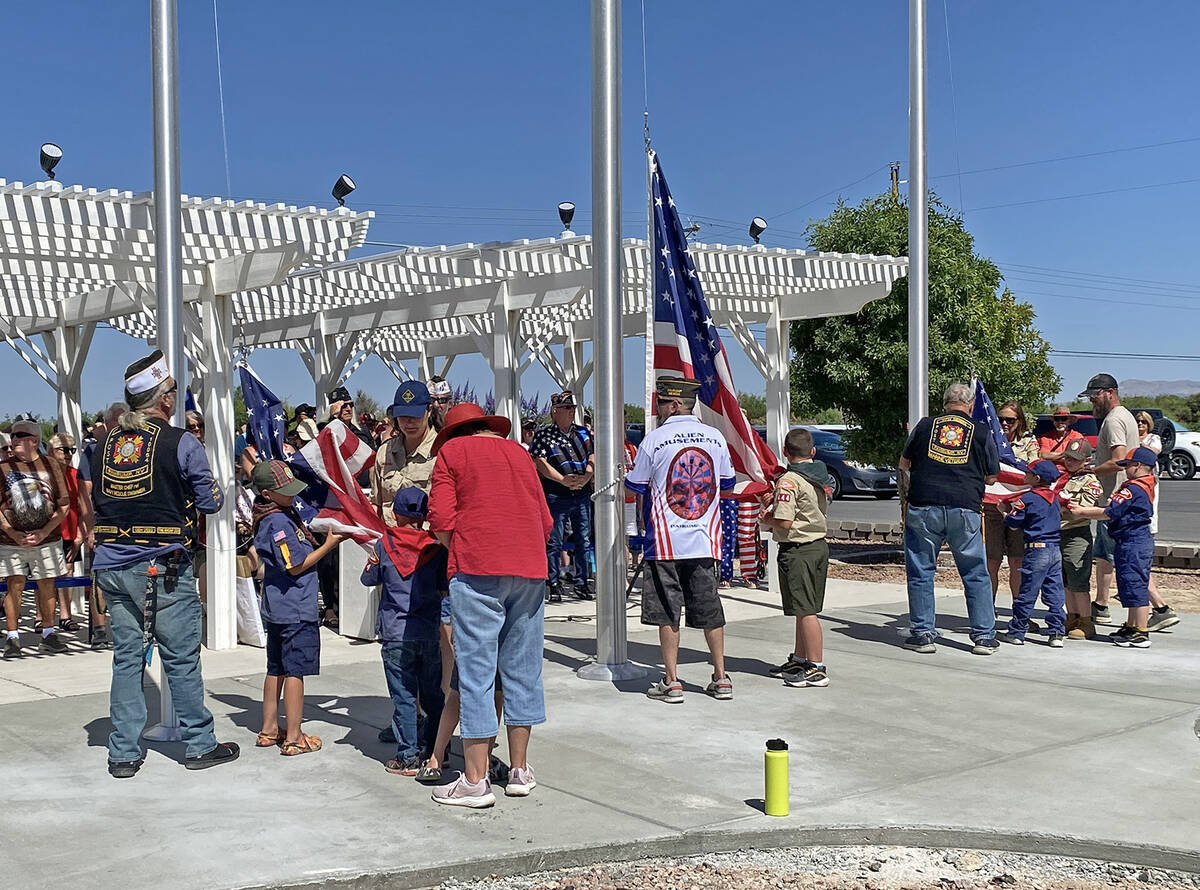 The Veterans of Foreign Wars Post #10054 was assisted by the local Cub Scouts in changing out t ...