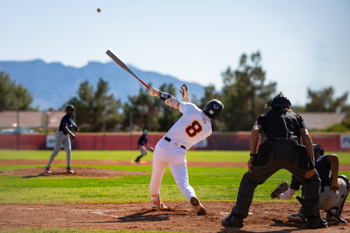 Pahrump Valley High School senior Kayne Horibe lifts a ball deep off a Canyon Springs pitcher d ...