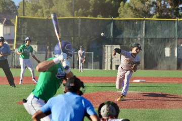 Pahrump Valley High School senior Kayne Horibe hurls a pitch toward the plate during a non-leag ...