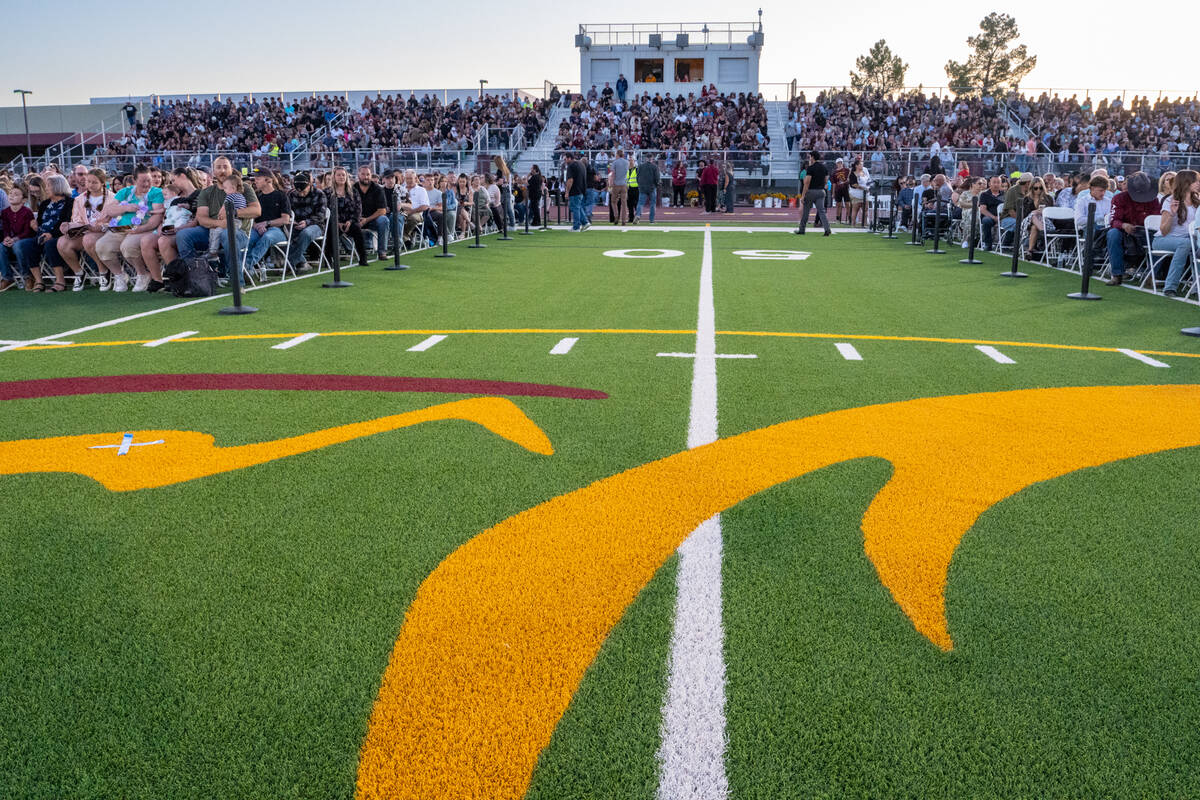 The Pahrump Valley High School football field hosted the graduation ceremony, with families of ...