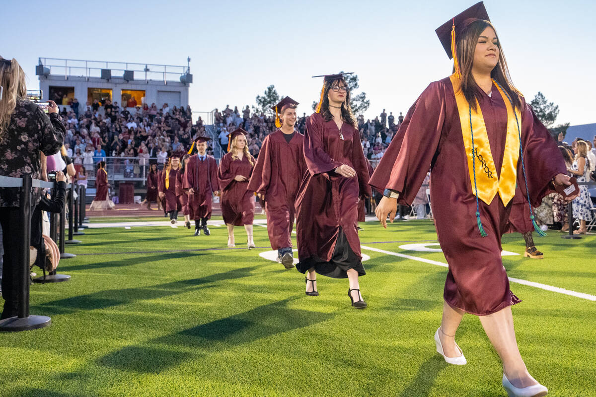 Two hundred seventy-one graduating students filed onto the football field at the start of the c ...