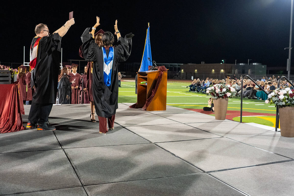 Graduates share a special hug, handshake or dance with Pahrump Valley High School’s Principal ...