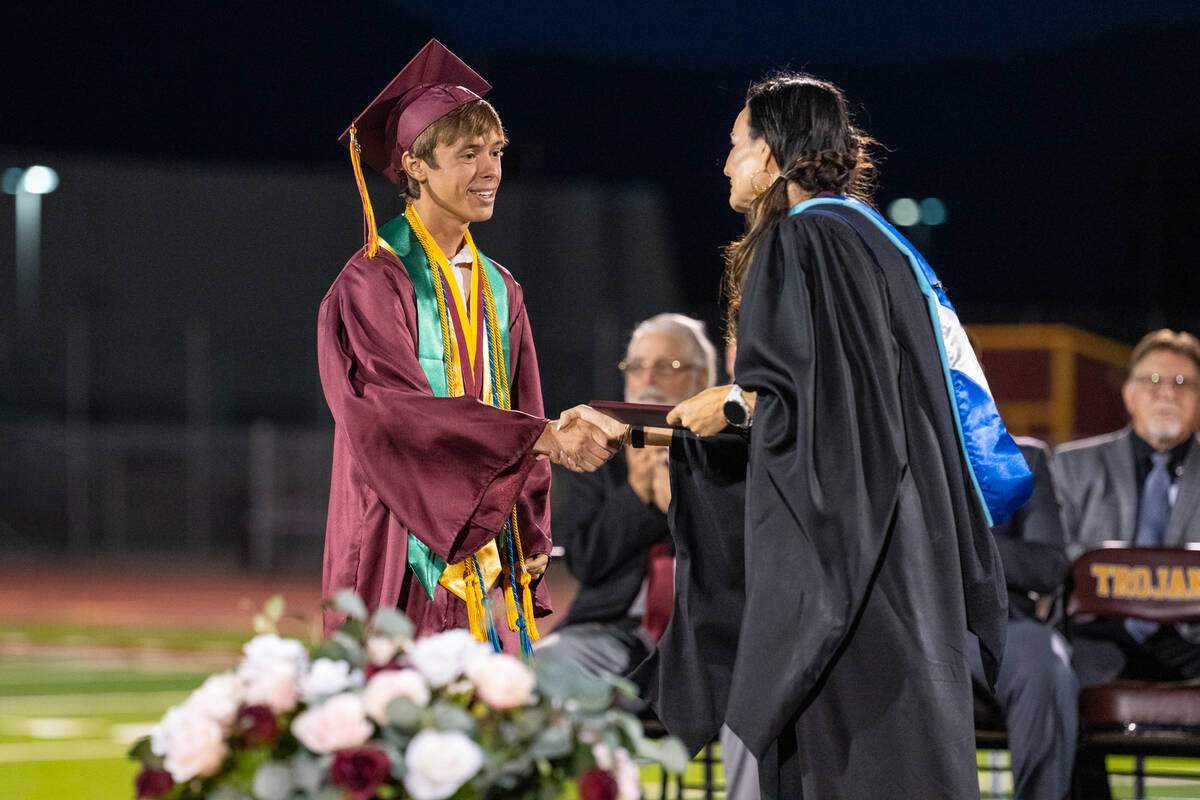 Valedictorian Timothy Stutzman receives his diploma from Pahrump Valley High School’s Princip ...