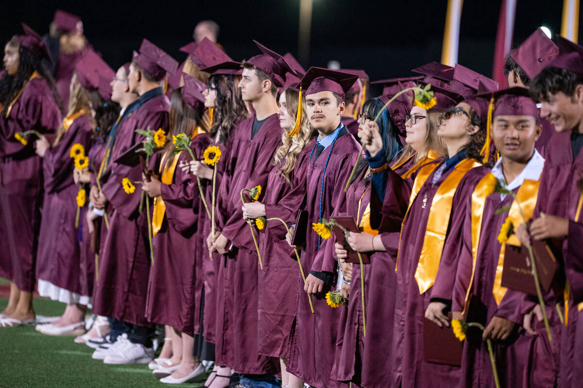 After receiving their diplomas, graduates were handed a sunflower, and returned to their seats. ...