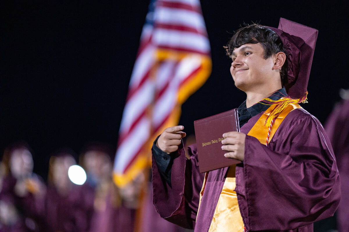 A graduate poses after receiving his diploma. (John Clausen/Pahrump Valley Times)