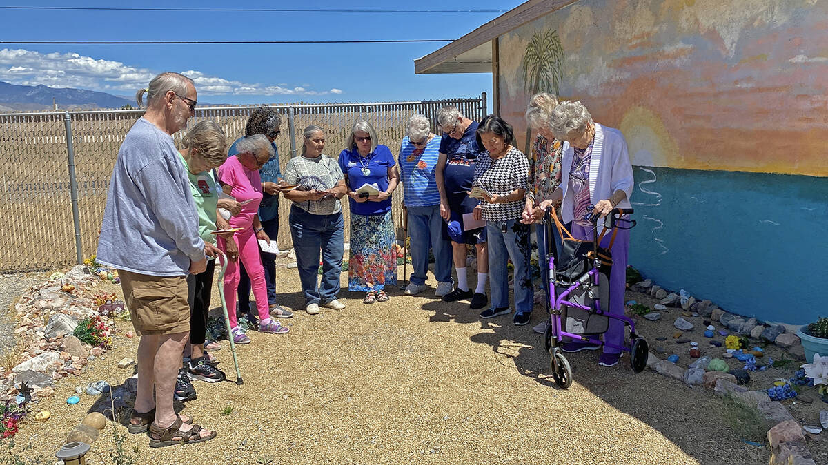 Members of the GriefShare chapter at Central Valley Baptist Church bow their heads in prayer pr ...
