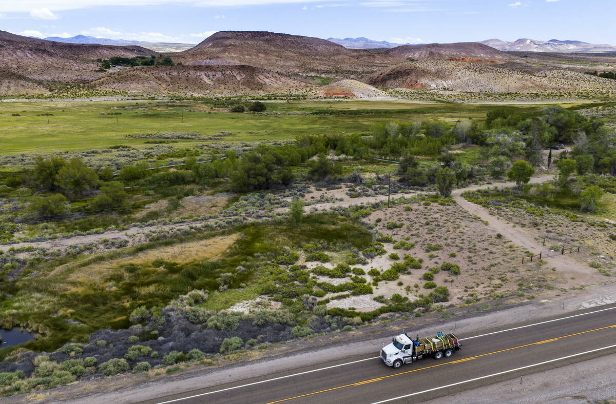 A truck passes the Torrance Ranch Preserve managed by The Nature Conservancy, with the Arthur g ...
