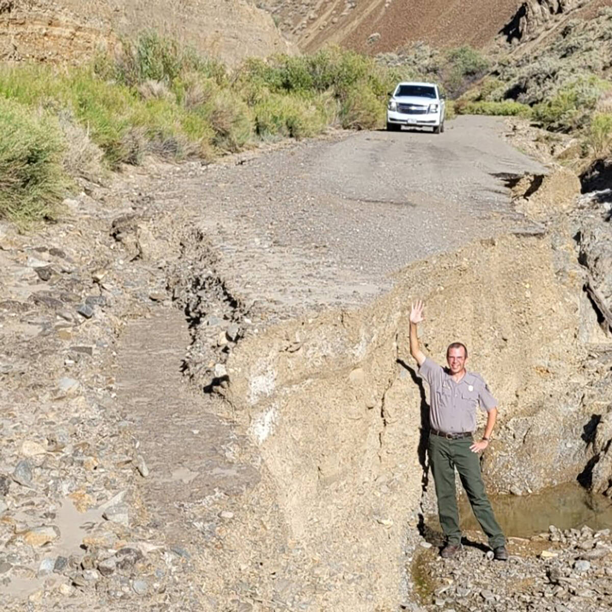 Death Valley National Park Superintendent Mike Reynolds shows the nine-foot-deep drop across Lo ...