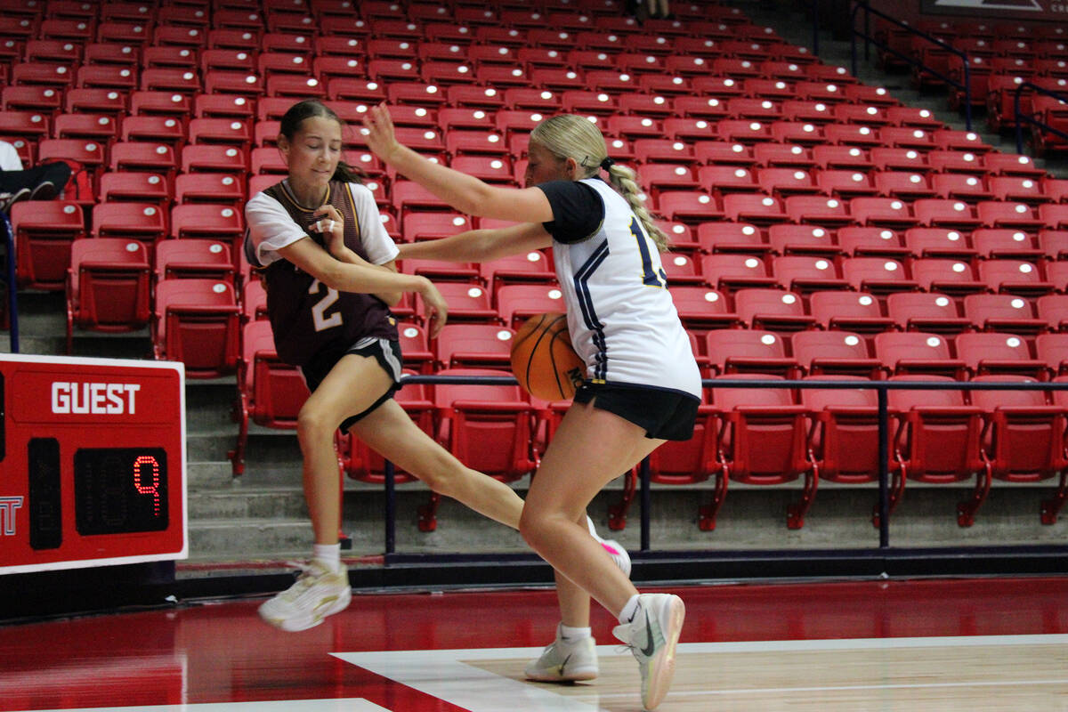 Pahrump Valley High School incoming junior Adi Nelson bounces an out-of-bounds ball off a Bonne ...
