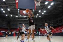 Pahrump Valley High School incoming senior Riley Saldana drives to the paint during an exhibiti ...
