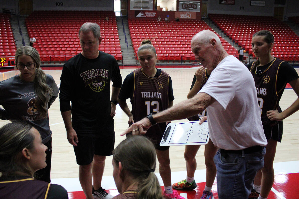Pahrump Valley High School head coach Bob Hopkins speaks to the varsity squad during a timeout ...