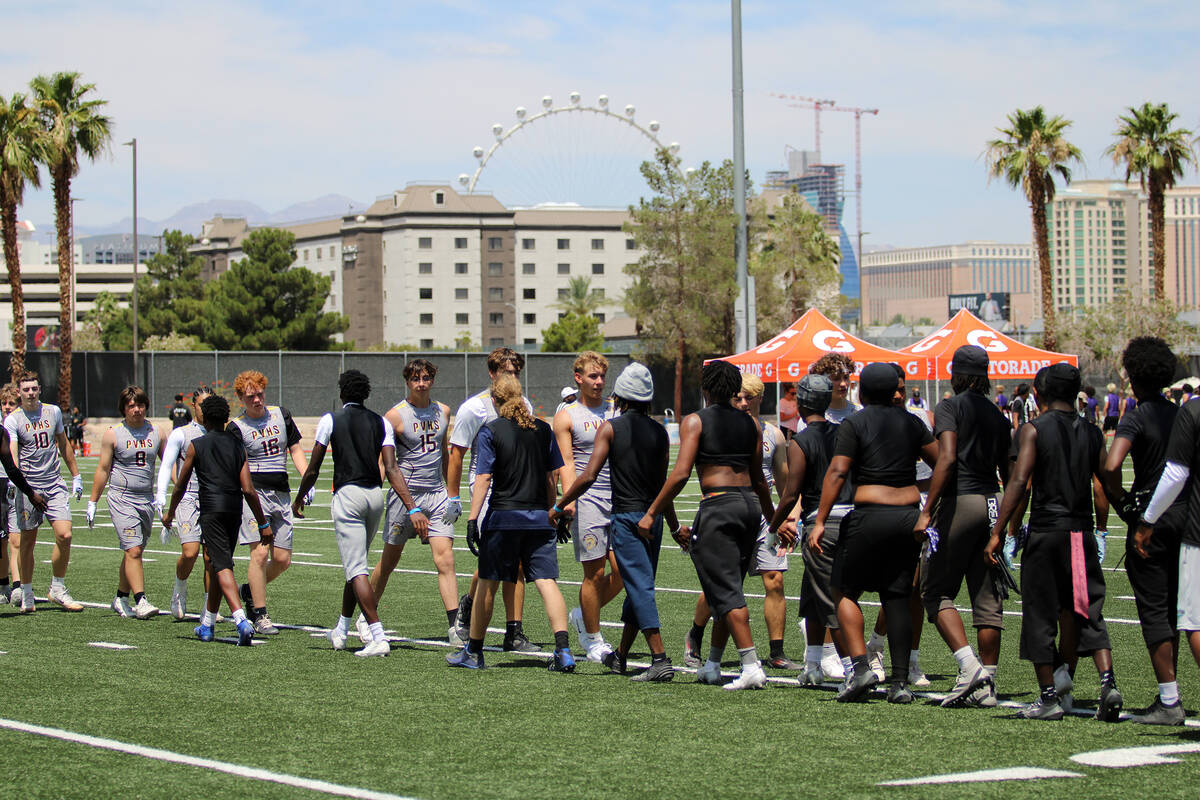 The Trojans shake hands with their opponent, Sliverado High School, after defeating the Skyhawk ...